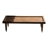 Table basse en teck brun indonésienne, bordure et pieds cylindres H40 L103