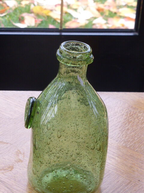 Biot stamped blown glass bottle