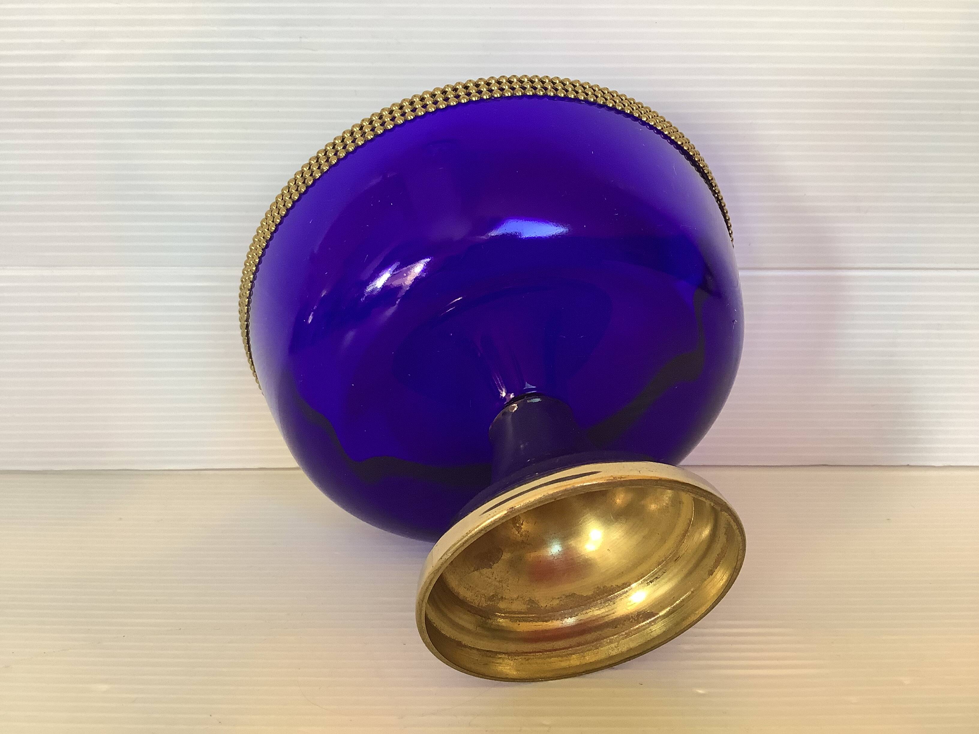 Cobalt blue trinket dish with a beaded pattern.
