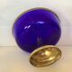 Cobalt blue trinket dish with a beaded pattern.
