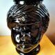 Vase or pot cover in the shape of a Moor's head made of glass from the 1970s.