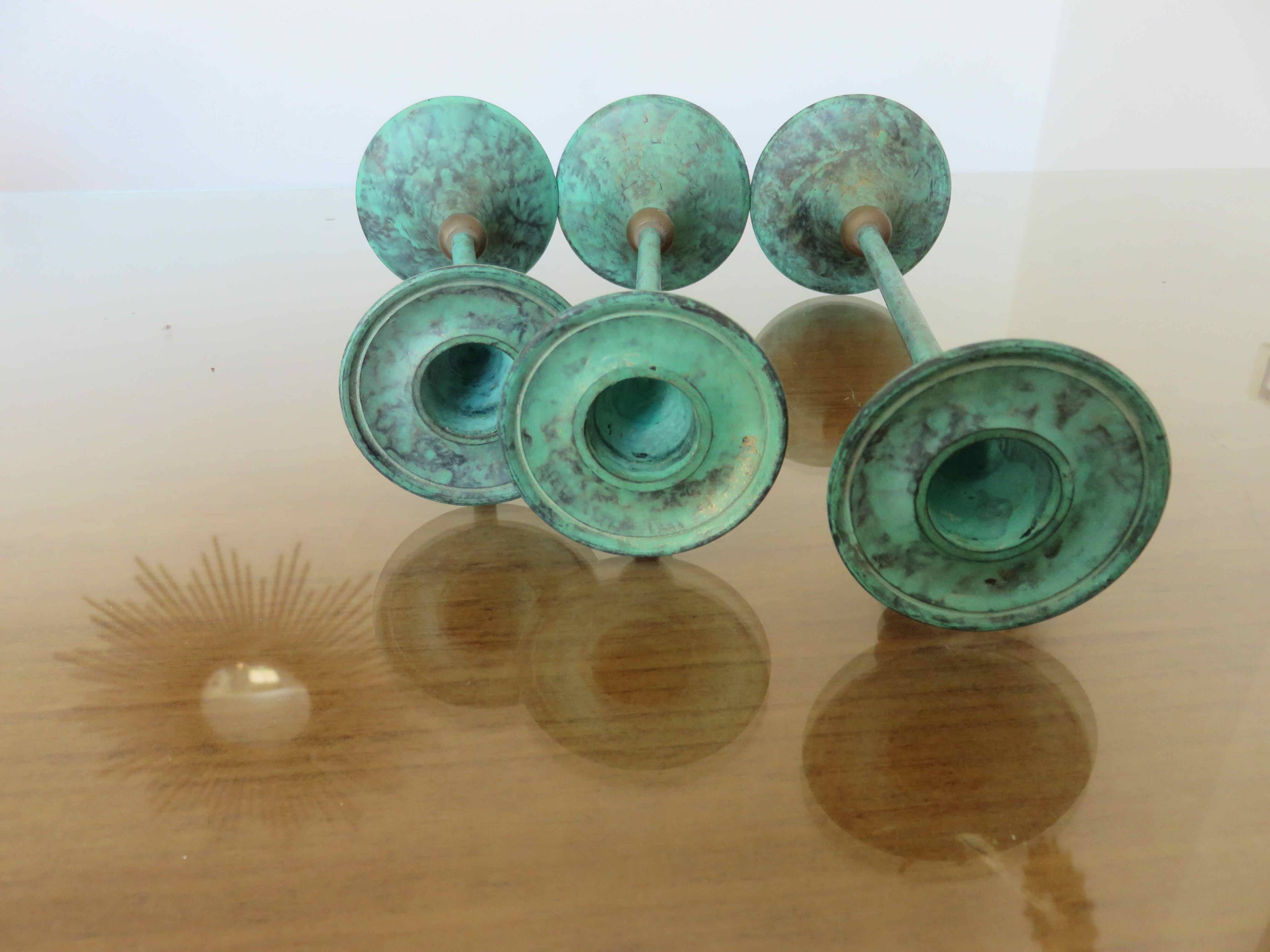 Series of 3 green tinted brass candlesticks from the 70s