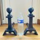 Pair of massive antique-style fire dogs in solid iron from the 20th century.