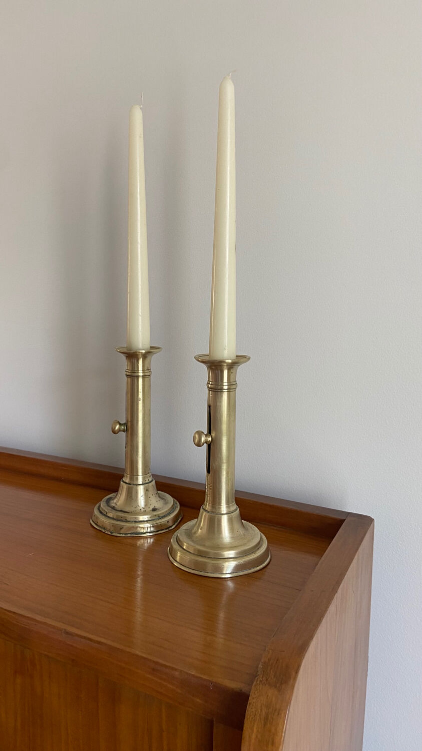 Pair of antique brass push candlesticks