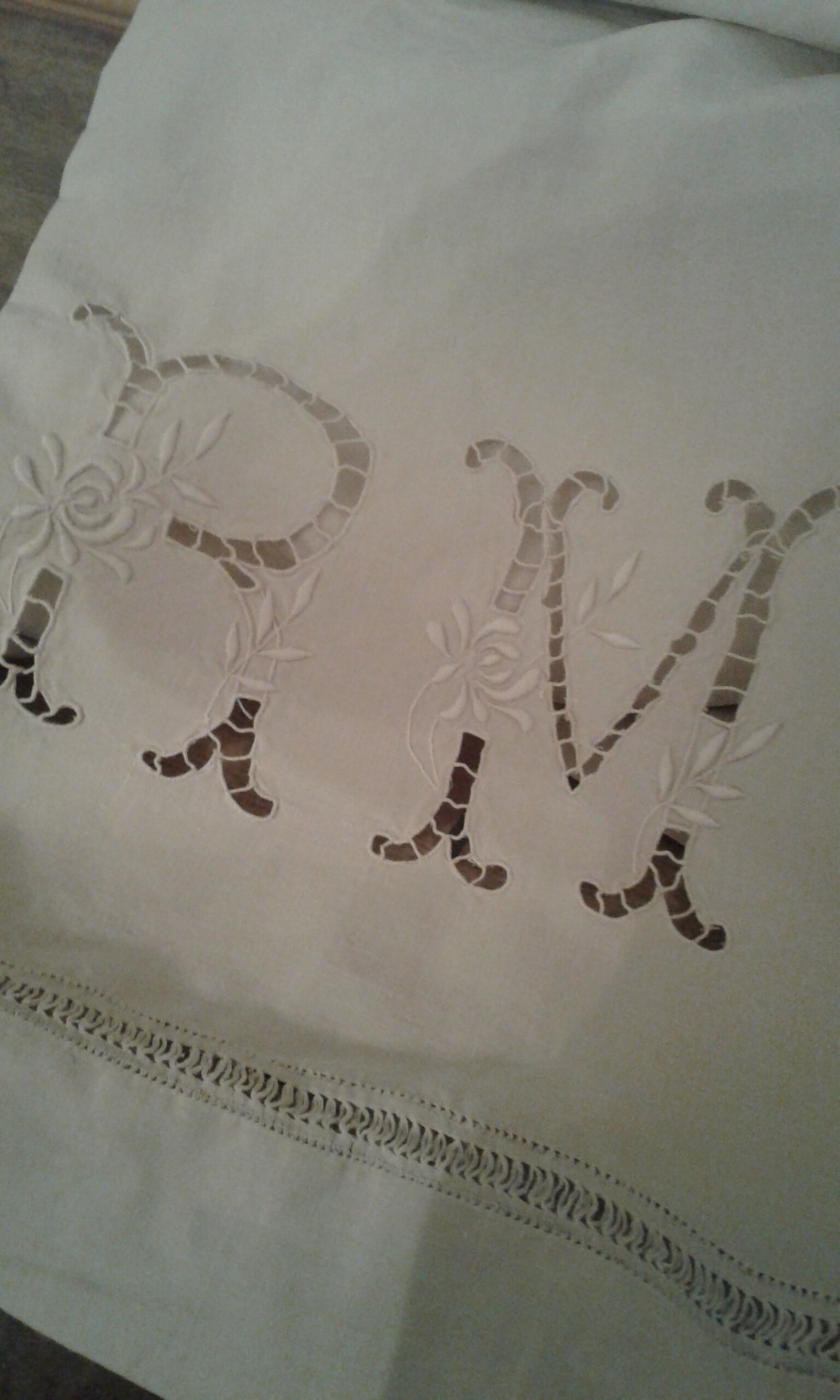 Old Lin Drap. Monogram embroidered and opened R M and 3 lines day