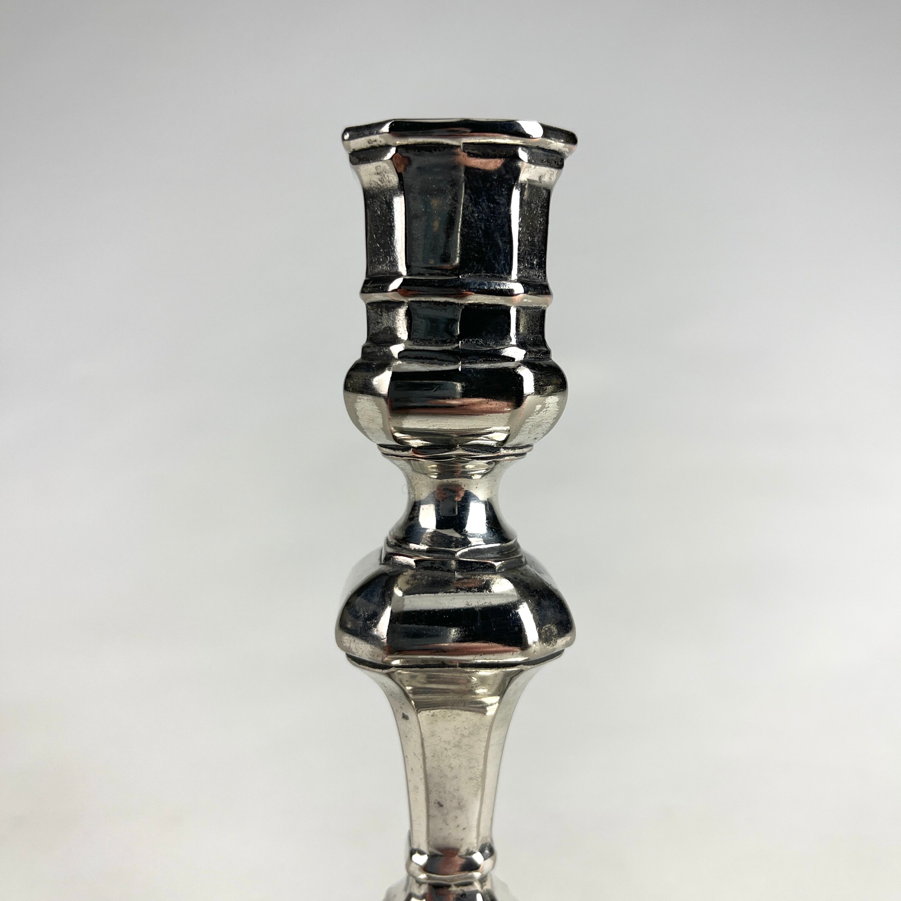 Pair of antique candlesticks in silver metal
