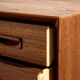 Restored teak chest of drawers with seven drawers.