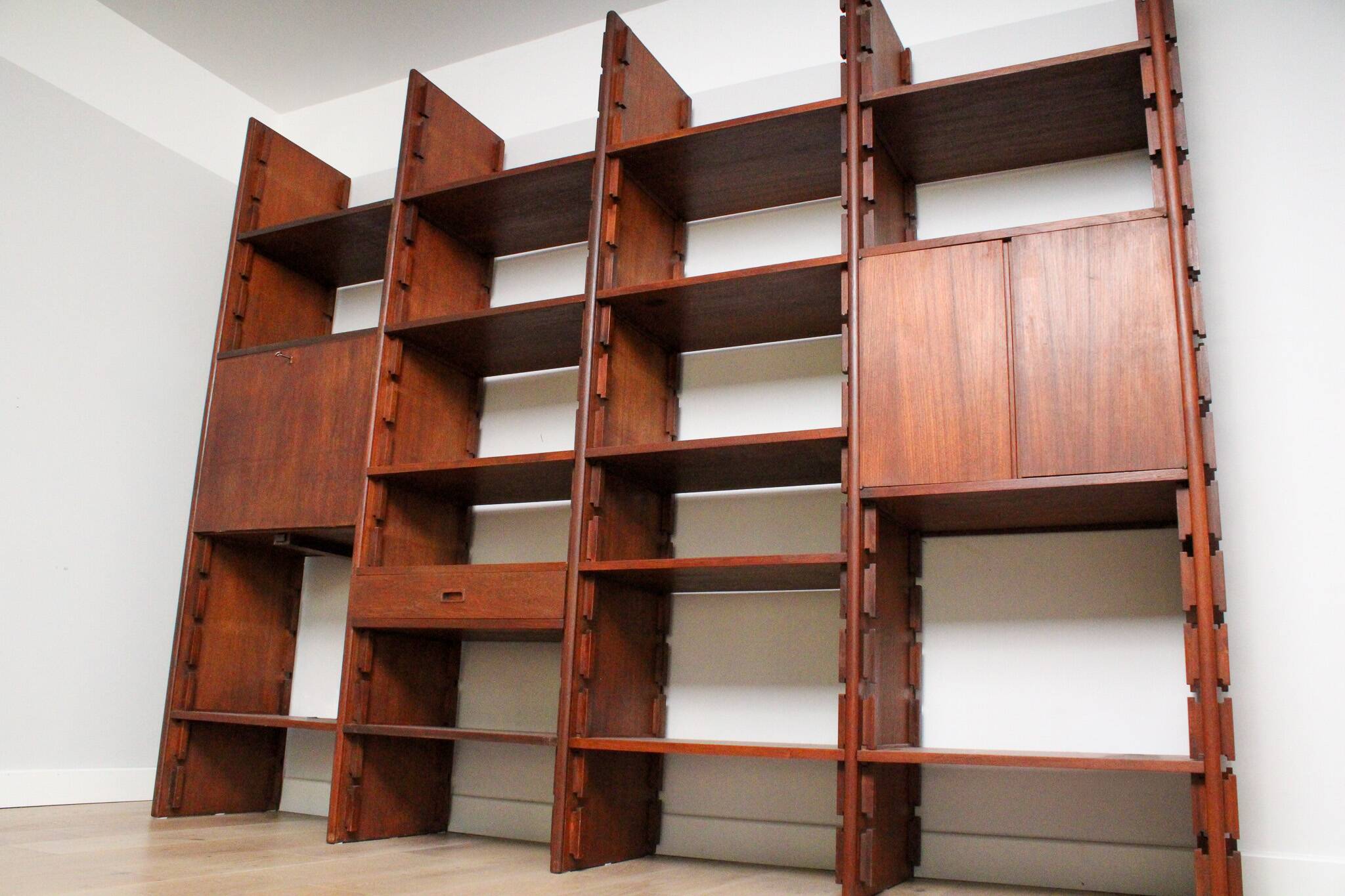 A vintage mid-century teak Gianfranco Frattini style bookcase room divider