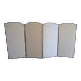 Vintage white faux leather screen with four studded panels, elegant decor.