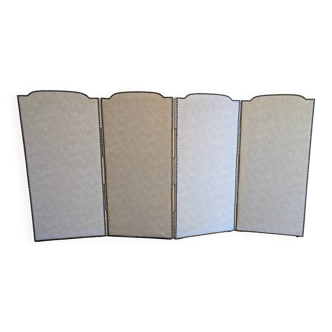Vintage white faux leather screen with four studded panels, elegant decor.