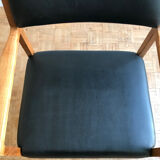 Chair in light teak and black skaï from the 1960s