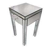 Bedside table covered with beveled mirrors on all sides