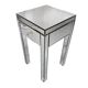 Bedside table covered with beveled mirrors on all sides