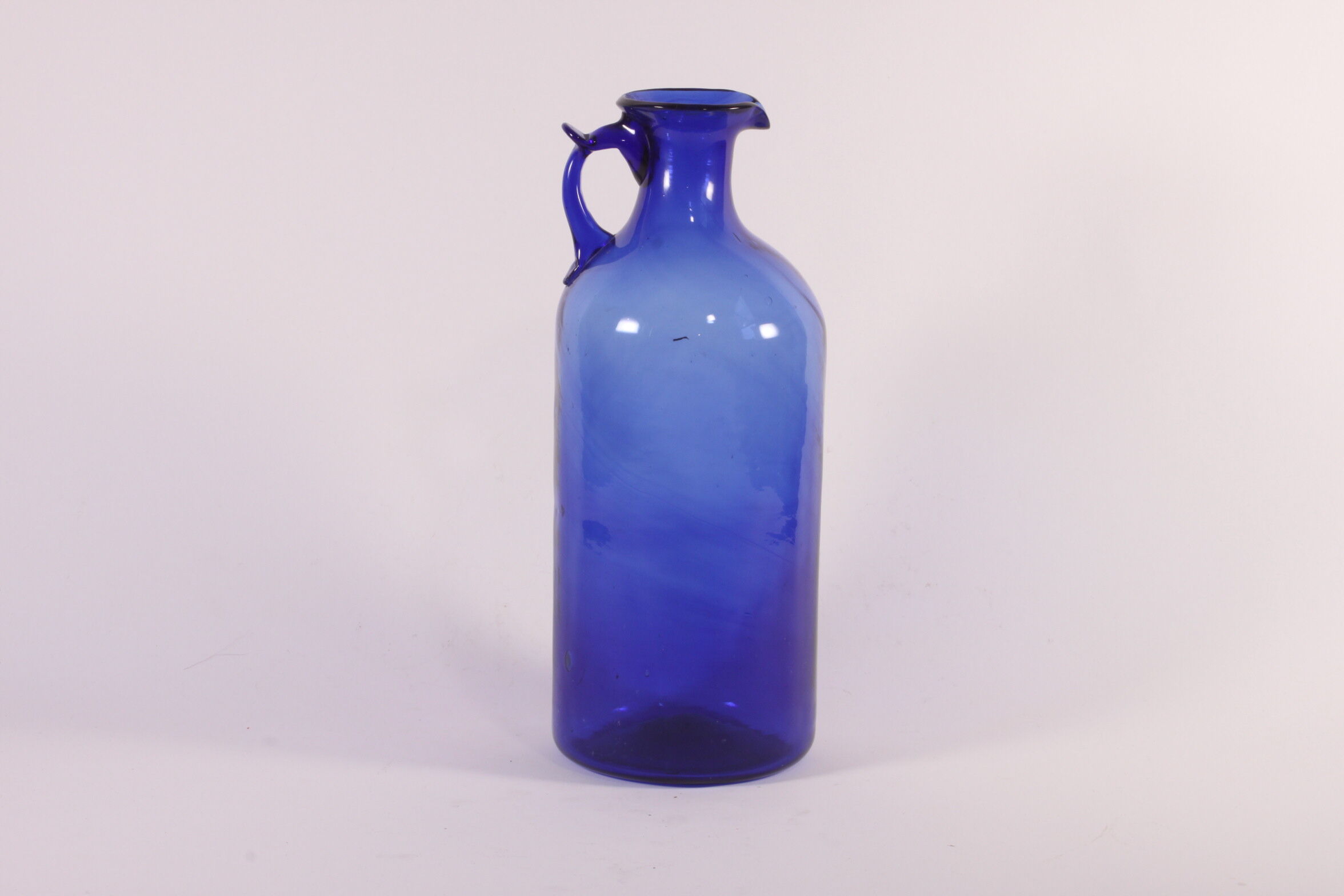 Antique handblown cobalt blue pitcher bottle, ca 1900.