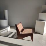 Reclined armchair in canned teak in natural wood