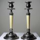 Pair of vintage candlestick holders in silver-plated metal with ivory-style plastic.