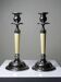 Pair of vintage candlestick holders in silver-plated metal with ivory-style plastic.