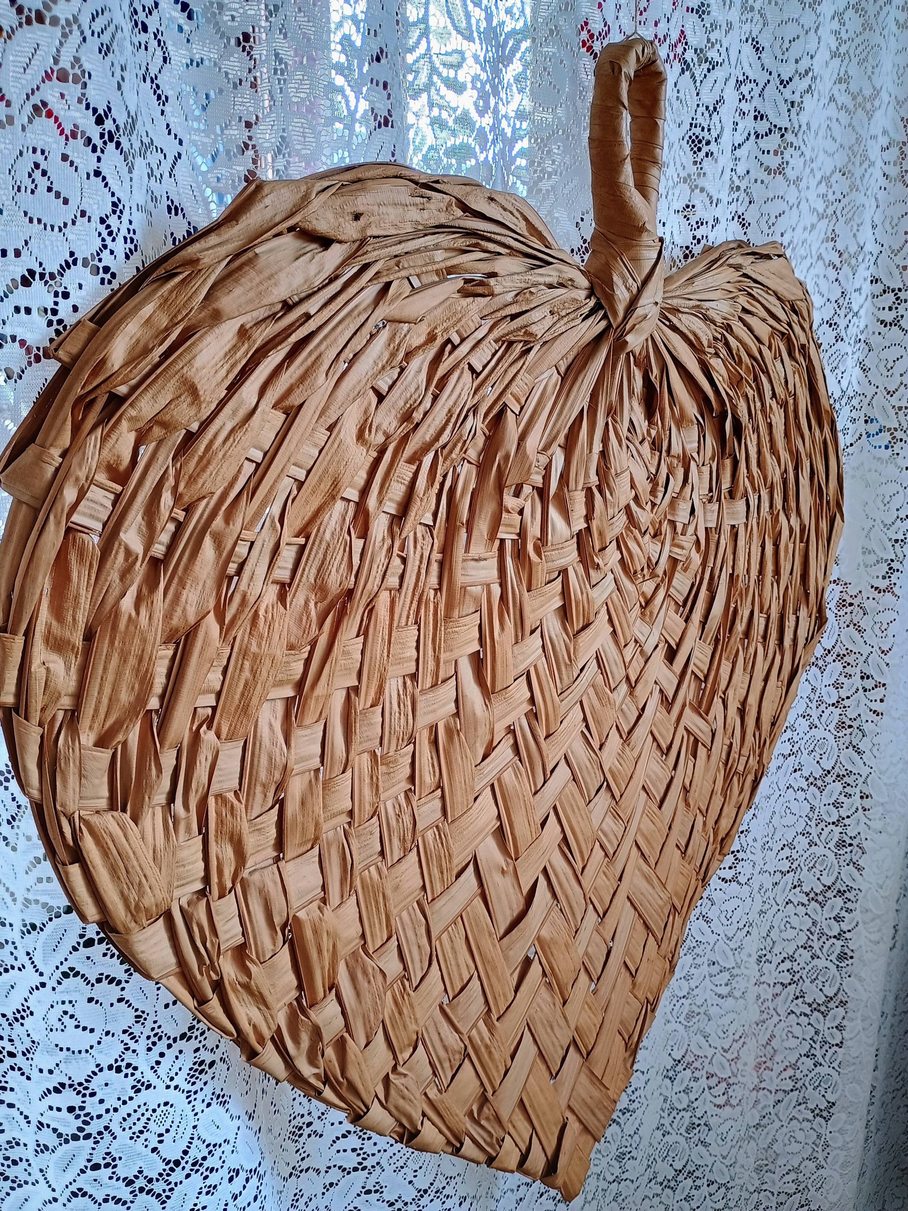 Heart fan in vintage woven palm leaves