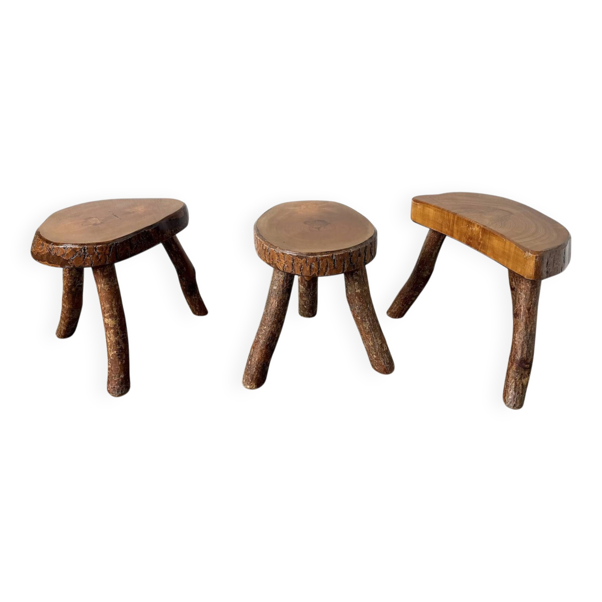 Set of three rustic solid wood tripod stools.