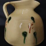 Vintage glazed terracotta ceramic jug from the 20th century.