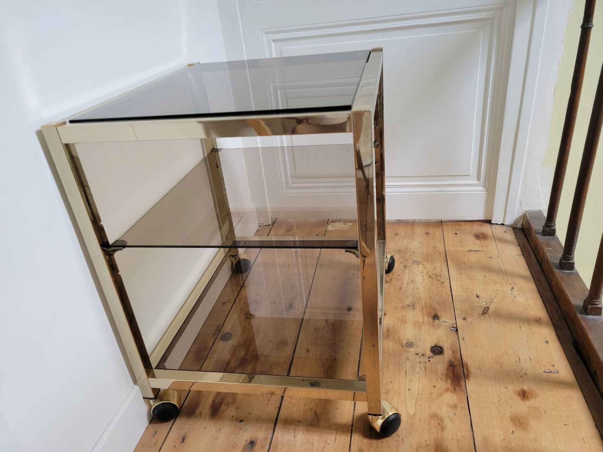 Gold metal and smoked glass serving trolley