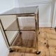 Gold metal and smoked glass serving trolley