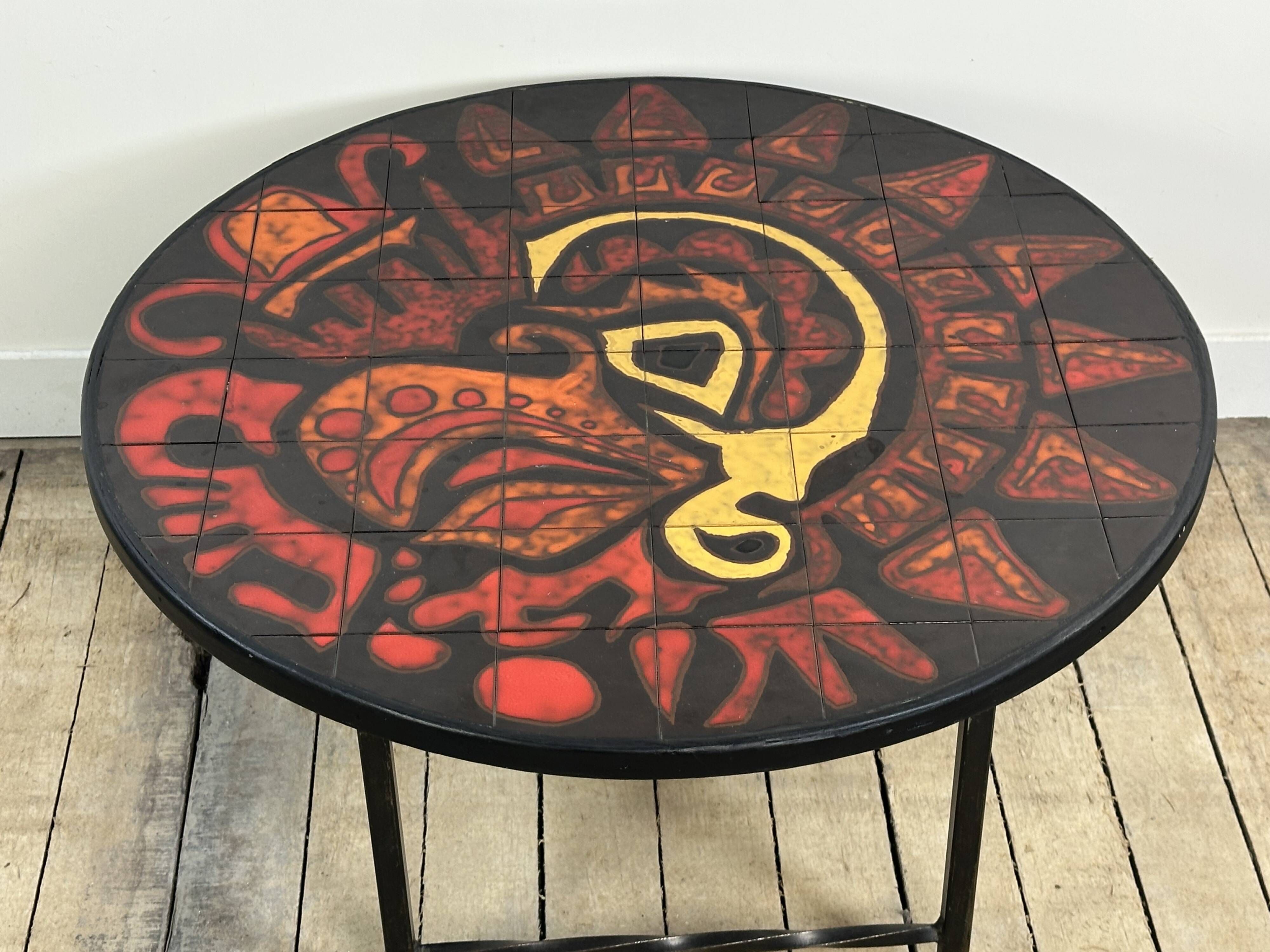 Vintage round coffee table in graphic red and yellow ceramic from the 1960s.