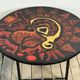 Vintage round coffee table in graphic red and yellow ceramic from the 1960s.