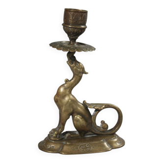 Hand-held bronze candlestick featuring a chimera subject from the 19th-century Empire period.