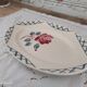 Oval dish in half-porcelain Badonviller red pink decoration and light gray blue braces