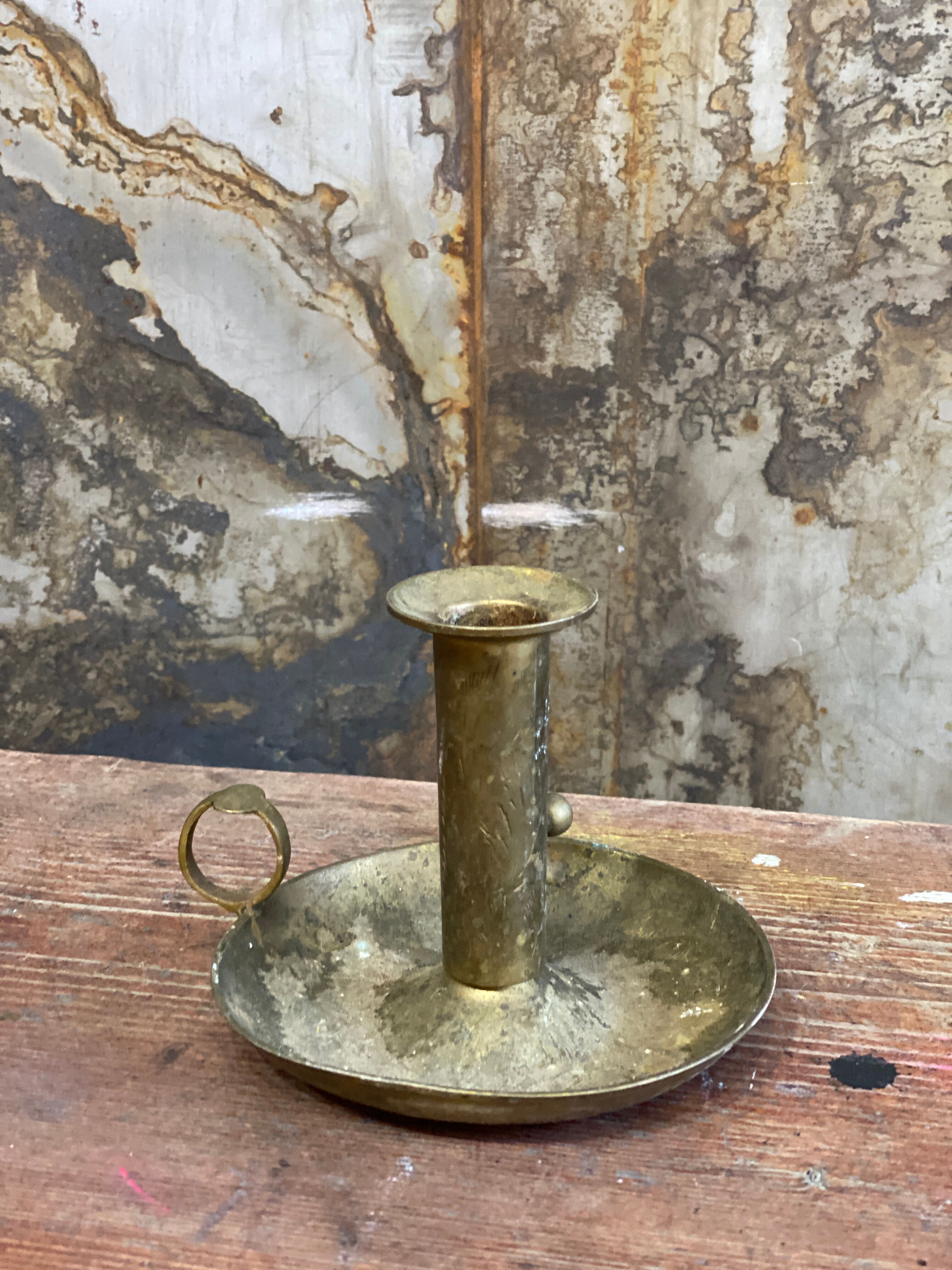 Brass hand candle holder