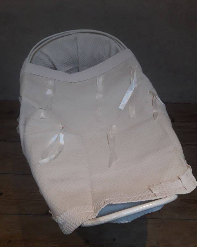 Wicker and painted wood baby cradle