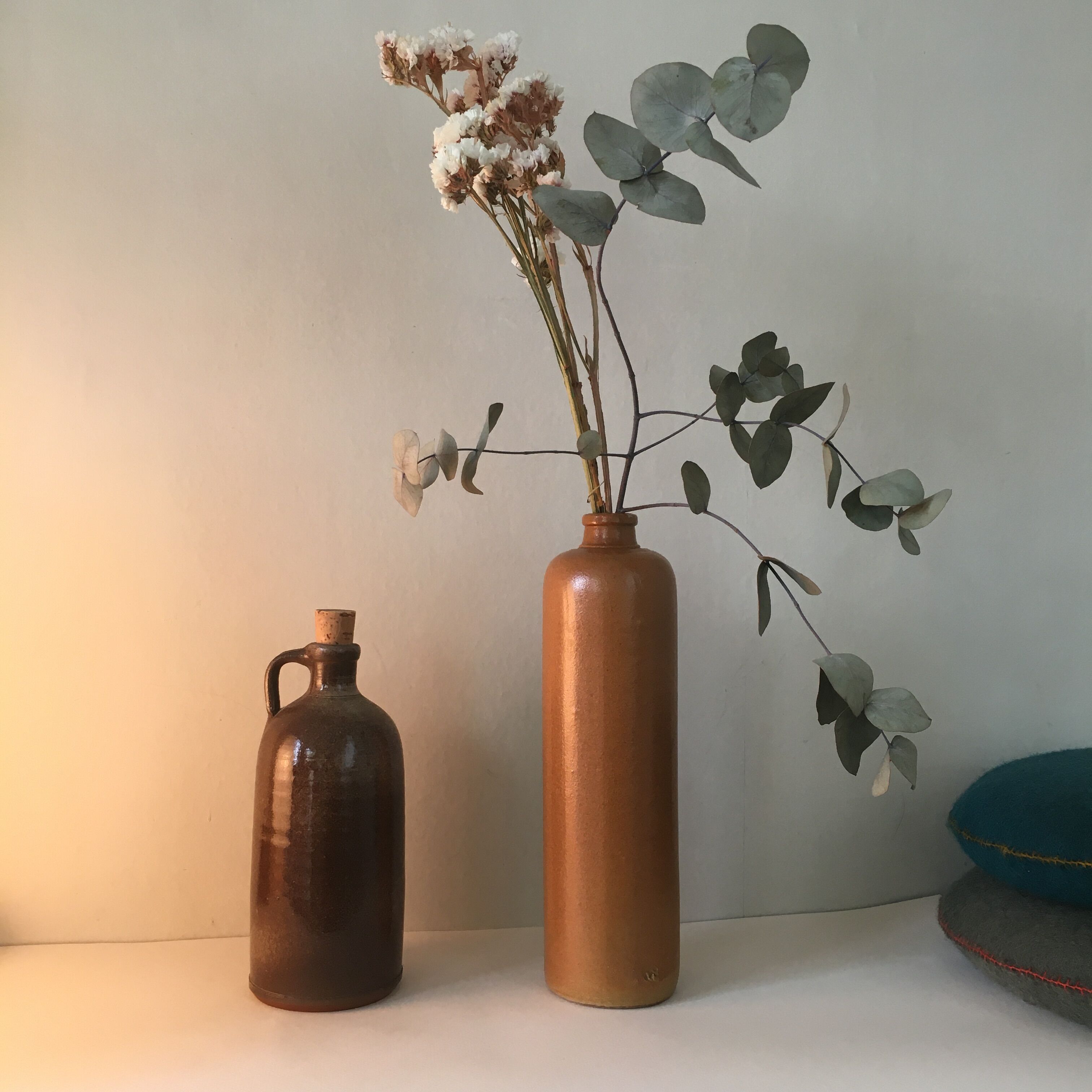 Duo of sandstone bottles