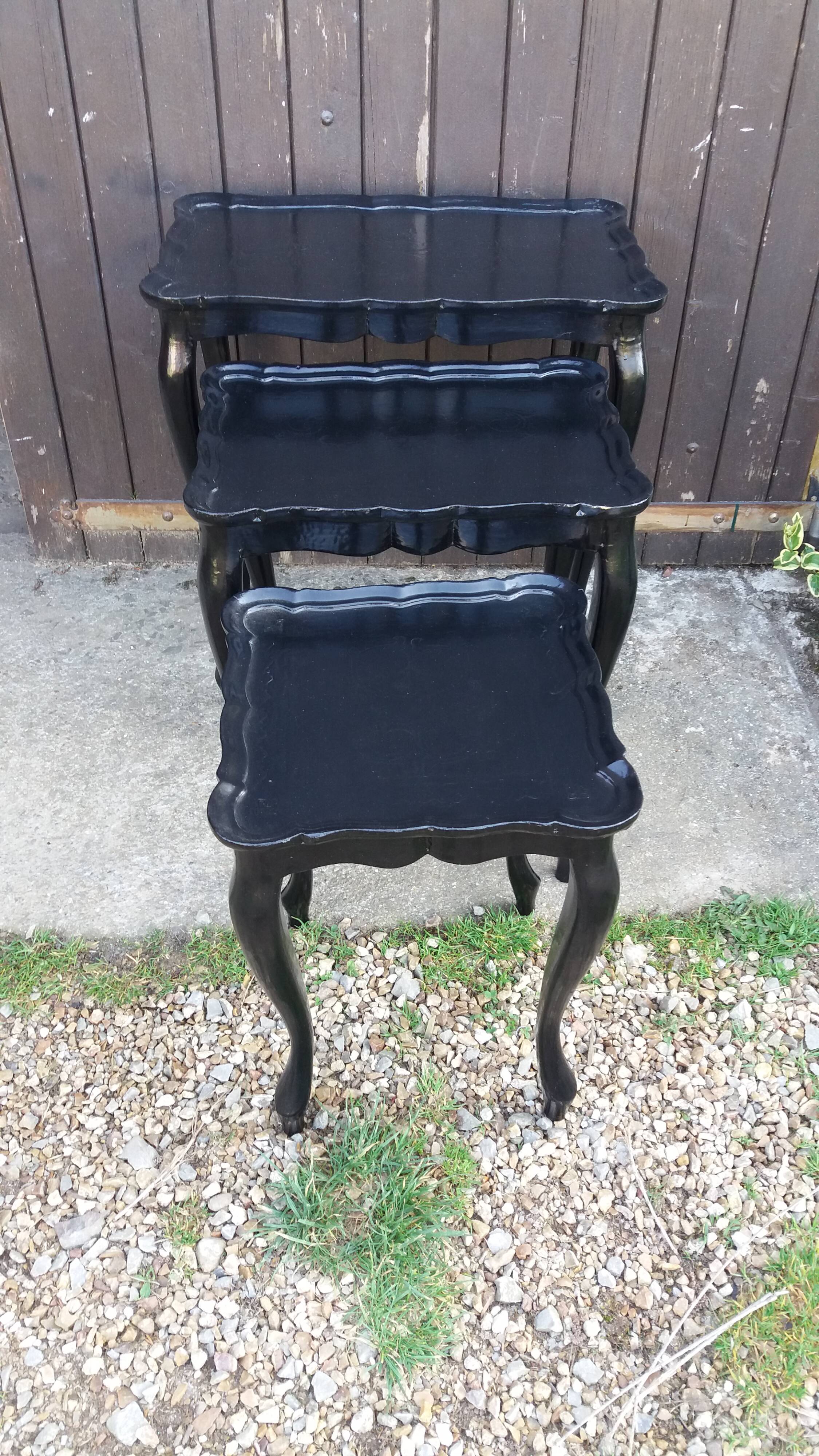 Set of 3 black nesting tables.