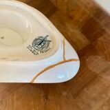 Ancienne saucière réparée avec la technique japonaise du kintsugi