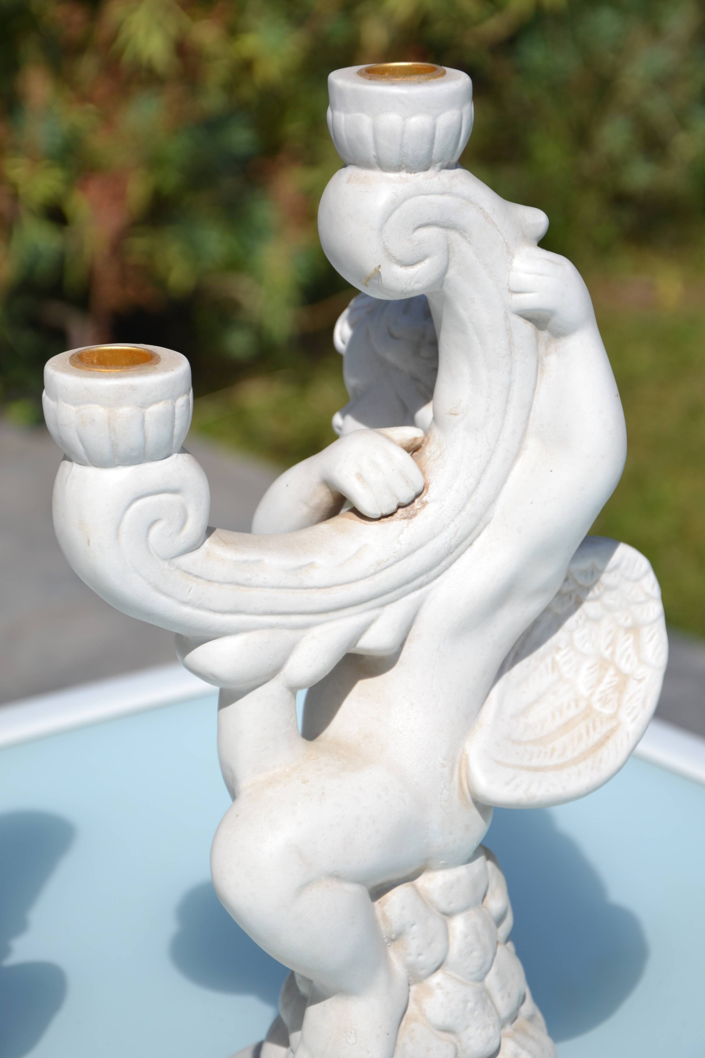 Pair of "cherub" candle holders in plaster