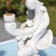 Pair of "cherub" candle holders in plaster