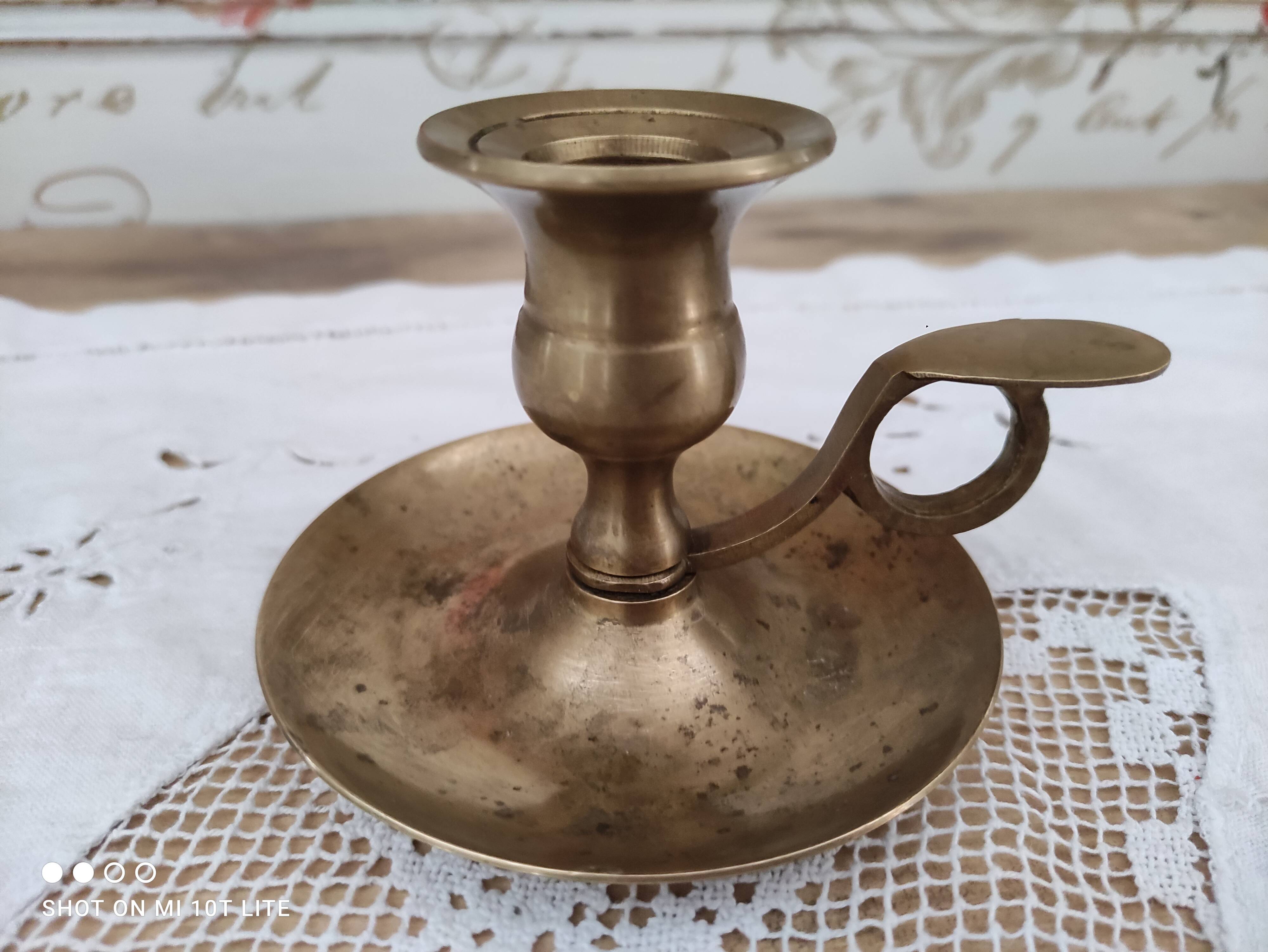 Hand candle holder called cellar rat in solid brass