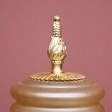 Table lamp with a tall base.