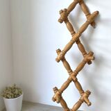 Wall accordion coat rack in light wood