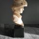 Elegant woman bust with alabaster shawl and black base of the 1950s