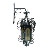 Black wrought iron lantern with stained glass. Medieval, Gothic decoration.