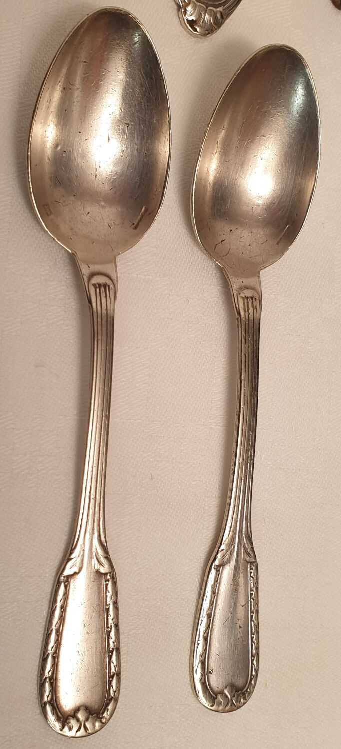 Set of mismatched silvered metal cutlery