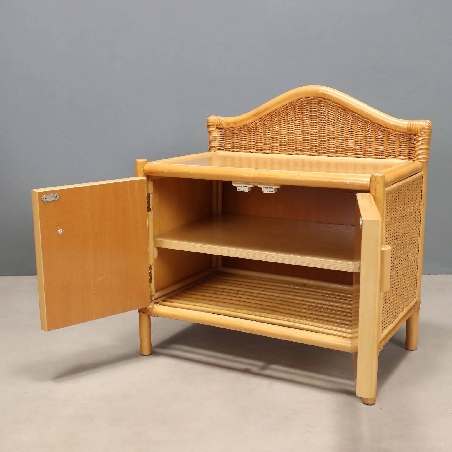 Pair of woven wicker bedside tables from the 1980s.