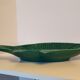 Ceramic serving flat plate in the shape of green fish