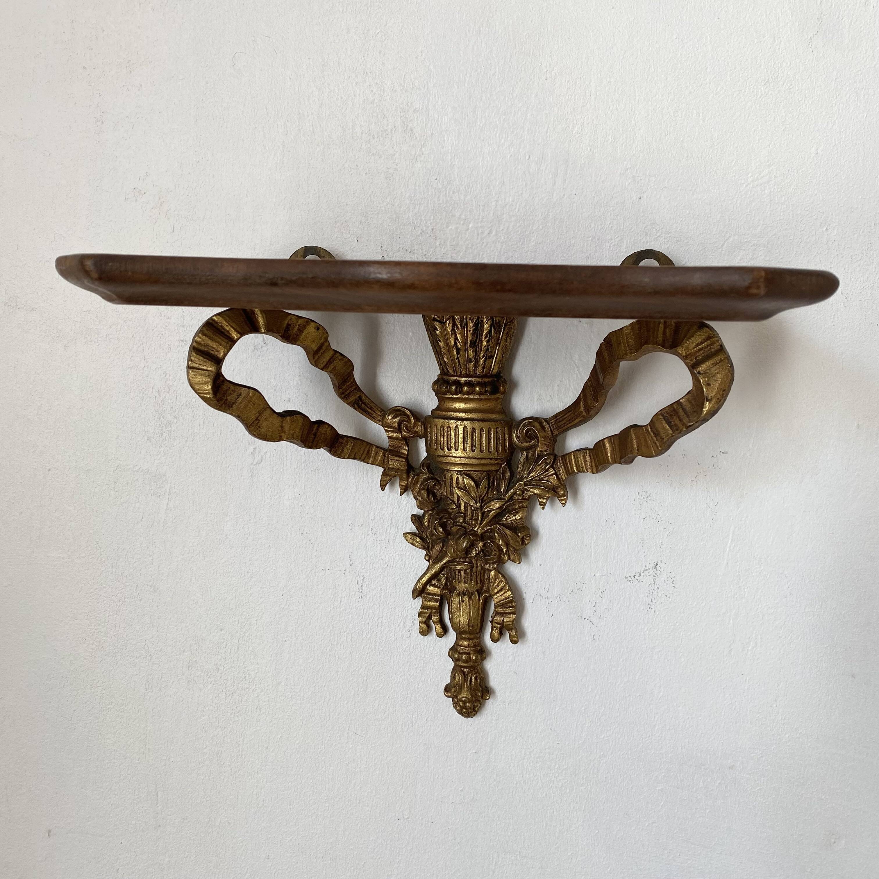 baroque shelf in wood and bronze ribbon