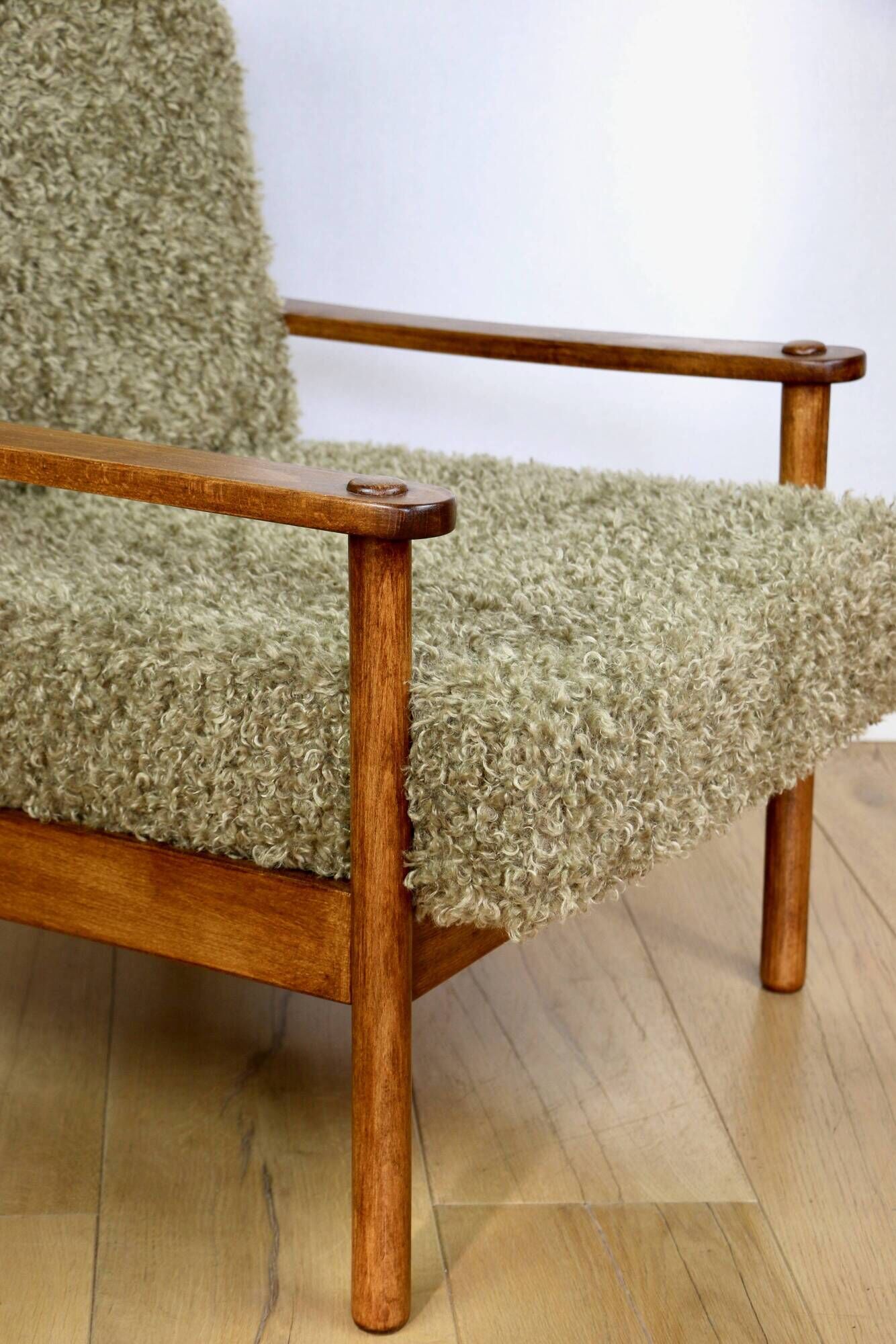 Wooden vintage brown armchair, olive green, long pile on removable cushions