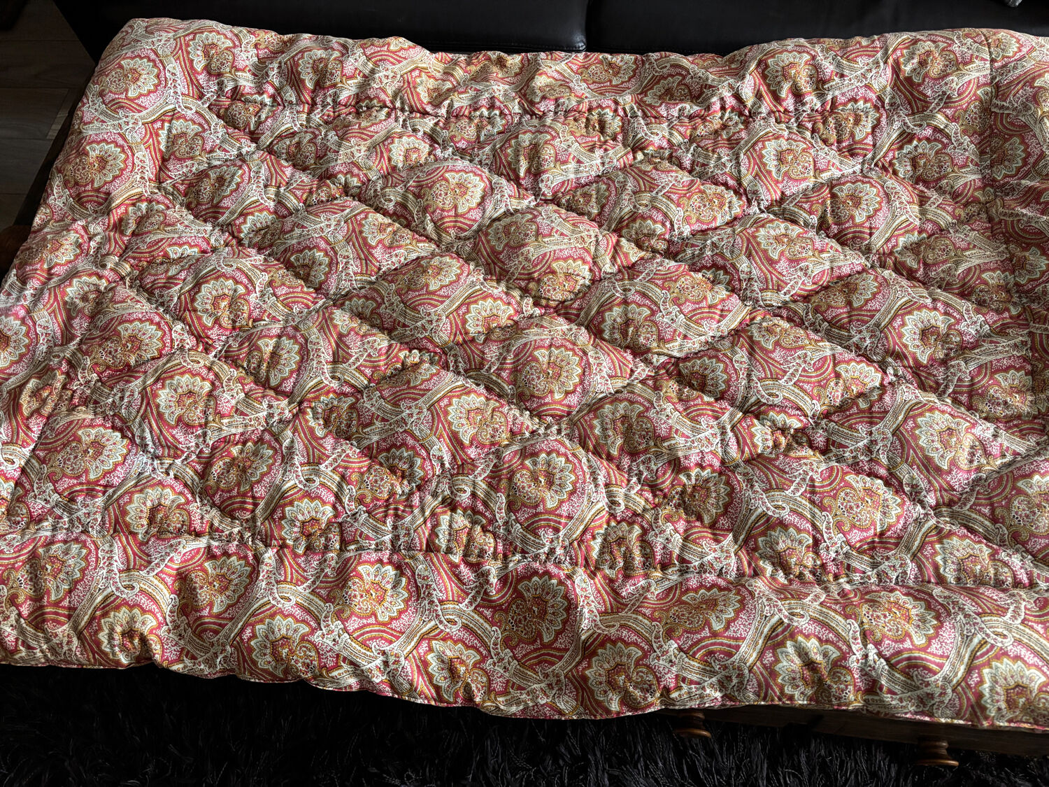 Vintage duvet/bedspread with a paisley pattern.