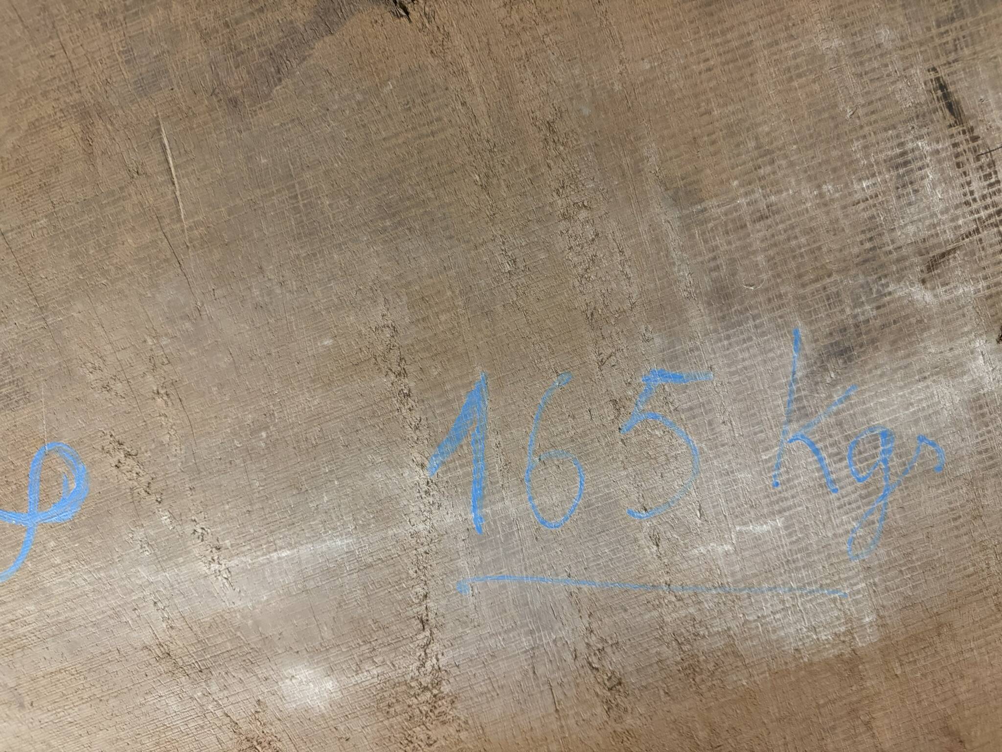 Industrial style table with a mahogany top.