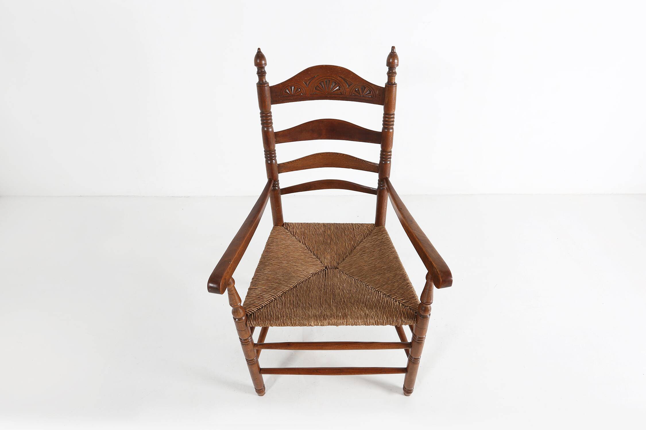 Antique wooden armchair with cane seat, France ca. 1900
